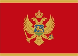 [ai] The flag of Montenegro featuring a red background, a golden border, and a double-headed eagle in gold with a shield on its chest displaying a lion, a crown above the eagle, and a scepter and orb in its claws.